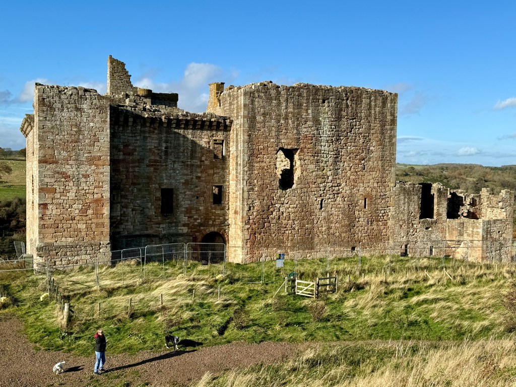 Another view from the south side, with person walking dogs below caste. 
