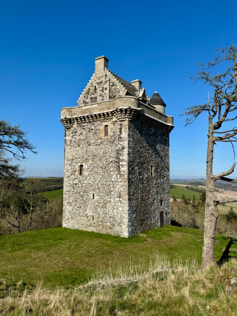 View from the south west, showing the valley below in the background.
