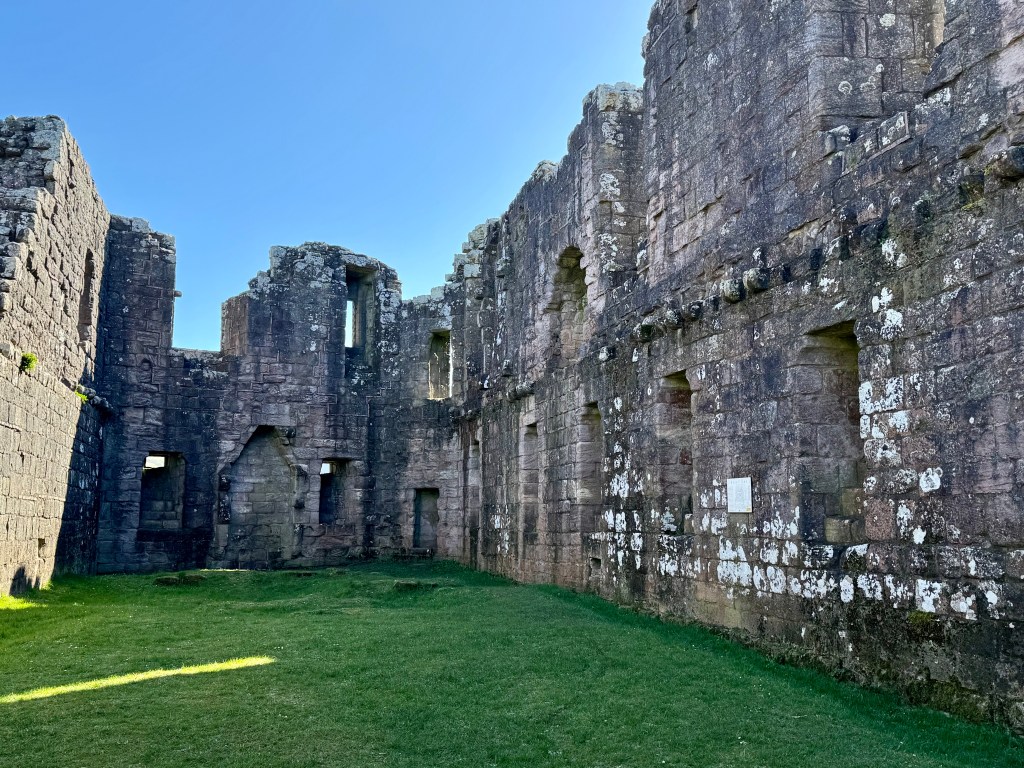 The far wall at the eastern end has a number of openings. Inerior walls are well weathered.