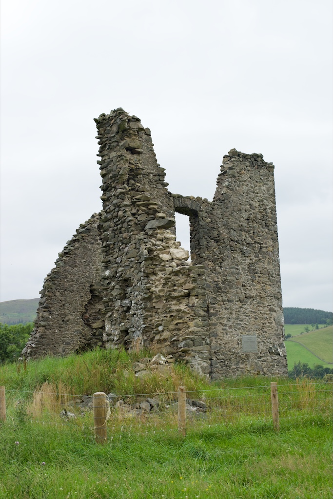 This close-up shows the badly damaged and weathered ruin, and the site of a more recently attached plaque.