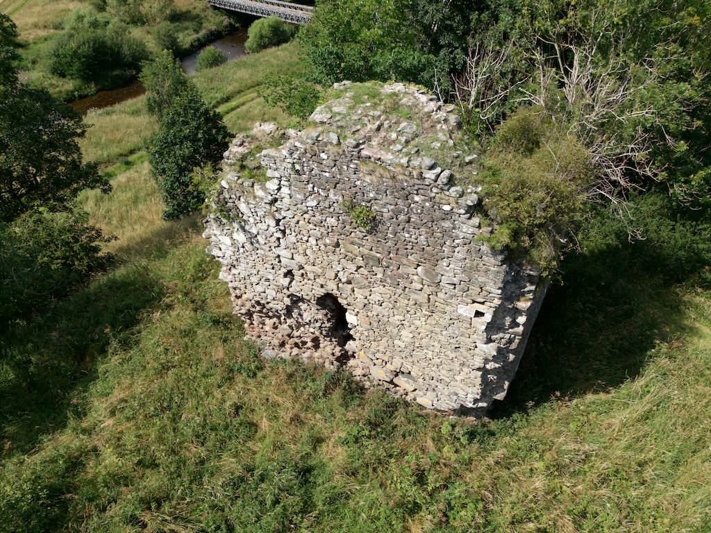 Drone view from south, looking down on the tower. Thickness of south wall is very apparent from this view.