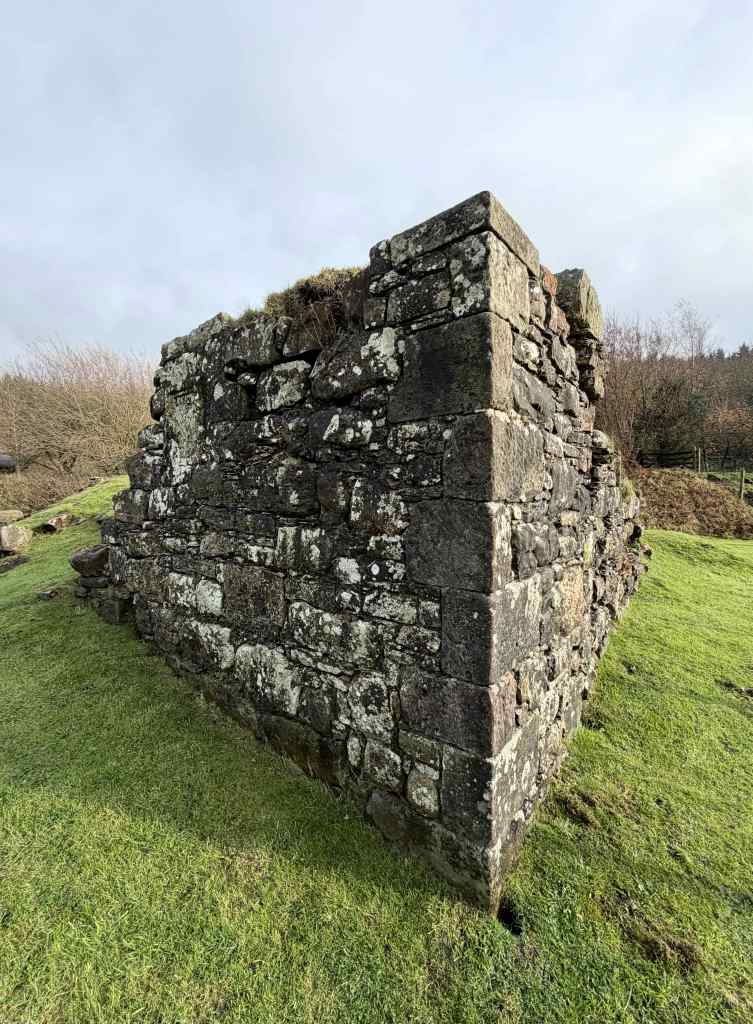 Close-up of restored corner section of wall, to a height of 2 metres. Straight edge to the corner. Otherwise, as in previous photos.