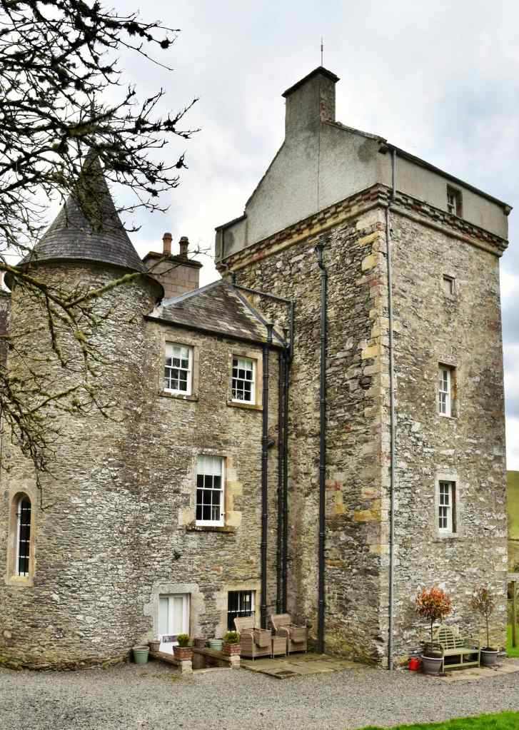 Another view from the north west. An old building is clearly visible under some of the modern touches such as guttering and downpipes.