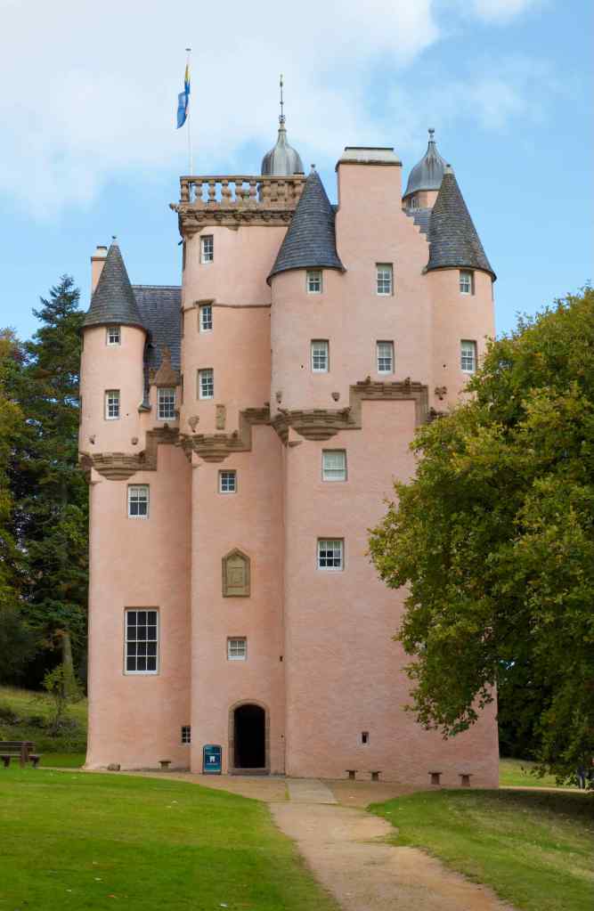 Direct close-up view of the south face of the castle, with the entrance door bottom left. The pink colour is awesome.