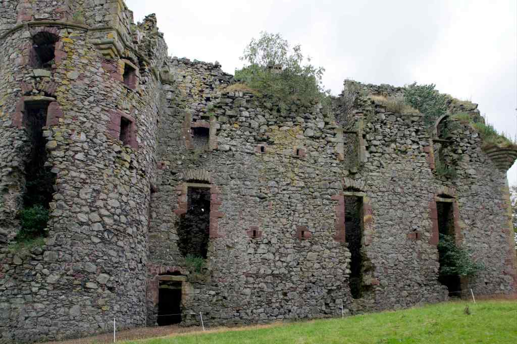 Close-up of the northern side, showing the red sandstone-dressed windows and the circular tower on the left.