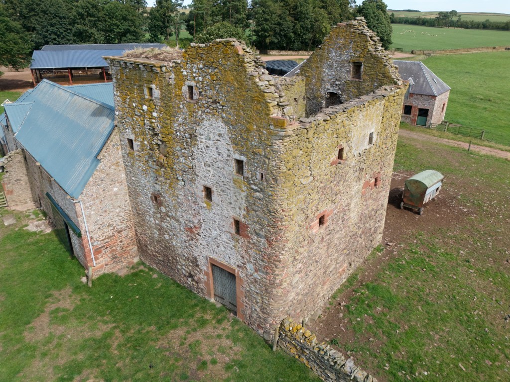 Drone image from south west, showing position in relation to farm buildings.