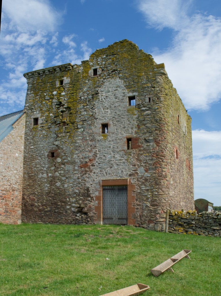 View from the west, showing small windows and entrance (that has been renovated)