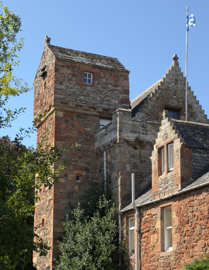 View of the Tower, taken from the grounds, showing the cap house and parapet.