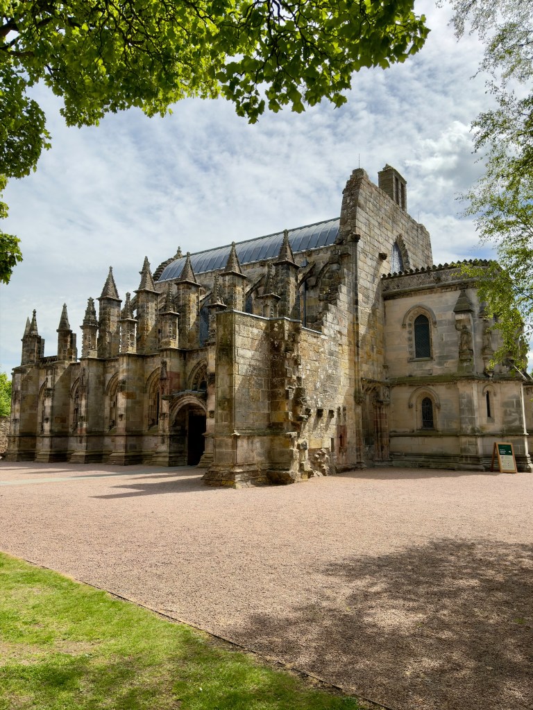The northern side with entrance and a series of small spires, with the main rounded roof rising above.